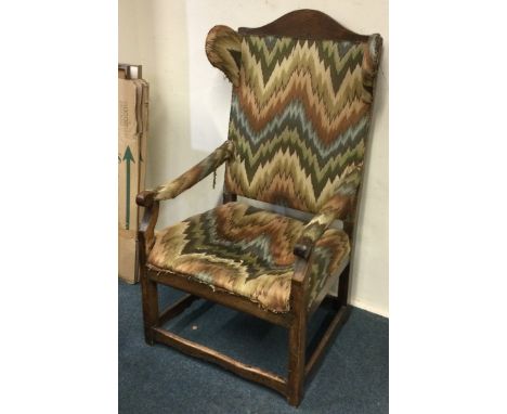  A good early oak chair with tapestry padding to stretcher base. Est. £250 - £350.