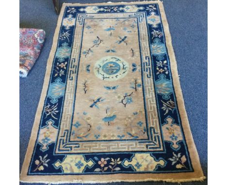 A stylish tapestry rug with central medallion. Approx. 120 cms x 218 cms. Est. £40 - £60.