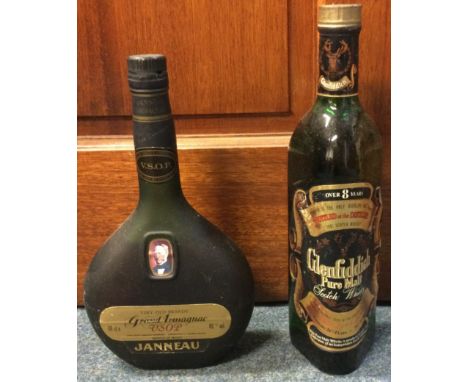 A 68 cl bottle of Janneau Very Old Brandy Grand Armagnac VSOP, together with a 26 2/3 fl. ozs bottle of Glenfiddich Pure Malt