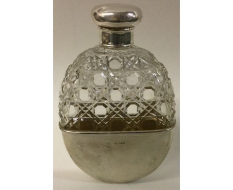 A large Victorian silver and cut glass flask with detachable cup. Est. £120 - £150.