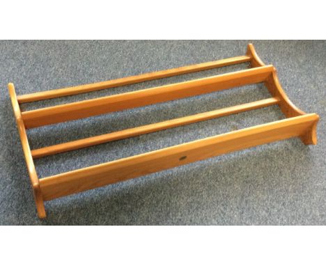 ERCOL: A light elm plate rack. Est. £20 - £30.
