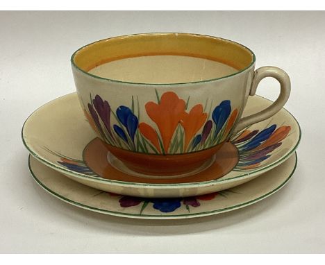 CLARICE CLIFF: An old pottery trio of typical form. Est. £20 - £30.