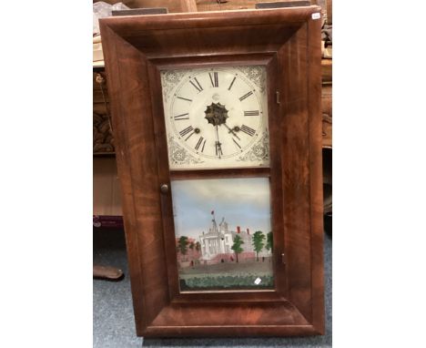 An old mahogany mounted wall clock. Est. £40 - £60.