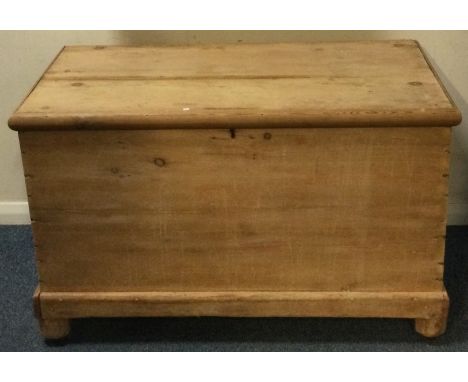 A large stripped pine trunk. Est. £50 - £80.