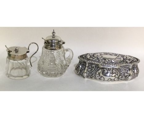 Two silver and glass mounted bottles of shaped form together with an oval trinket box. Est. £30 - £40.