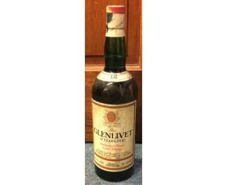 A 1980's 26 2/3 fl ozs bottle of Glenlivet 12 Years Old Unblended all malt Scotch Whisky. Est. £50 - £80.