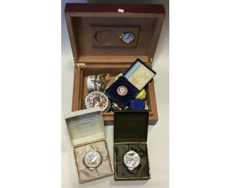 A good collection of porcelain mounted trinket boxes. Est. £20 - £30.