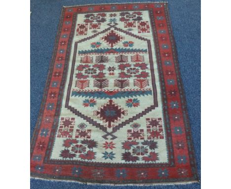 An old tapestry rug. Approx. 108 cms x 191 cms. Est. £20 - £30.