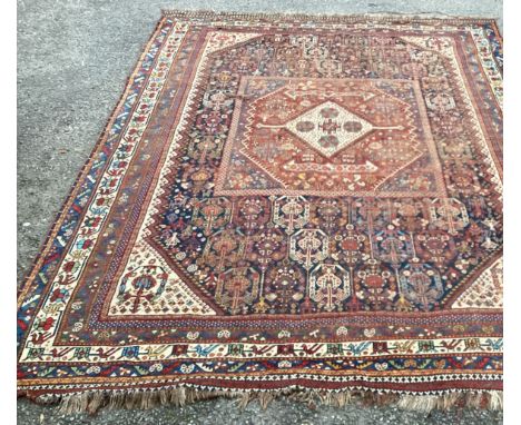 A good Oriental ground carpet / rug decorated in bright colours. Approx. 205 cms x 280 cms. Est. £80 - £120.