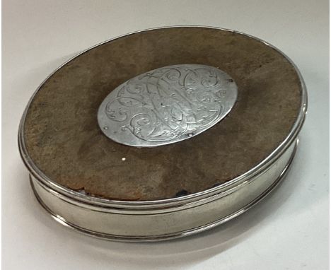 An 18th Century silver, wood and tortoiseshell snuff box with lift-off lid. Approx. 86 grams. Est. £150 - £200.