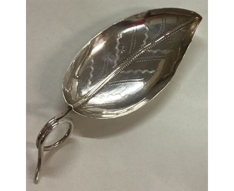 A Georgian bright-cut silver caddy spoon with leaf pattern. Birmingham 1800. By Joseph Angel. Approx. 6 grams. Est. £50 - £80