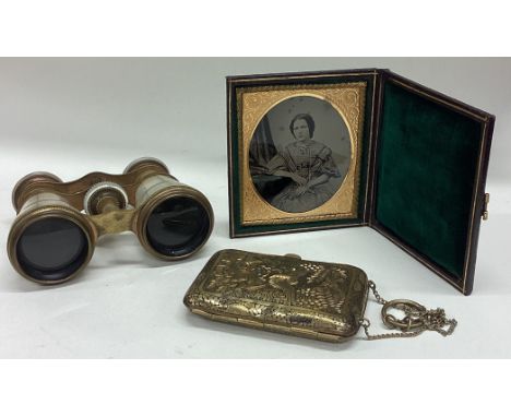 A small cased compact together with opera glasses etc. Est. £20 - £30.