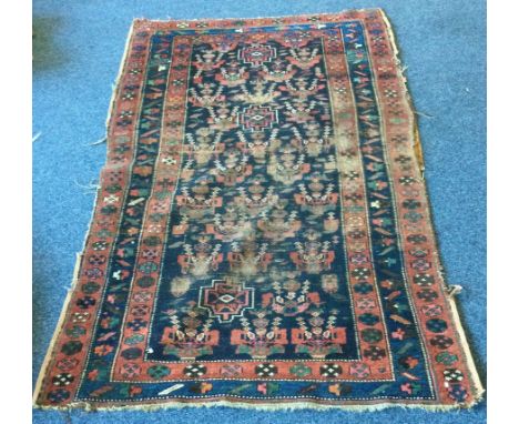 An old tapestry rug. Approx. 112 cms x 200 cms. Est. £30 - £50.