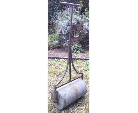 A good wrought iron and sandstone roller. Est. £30 - £50.