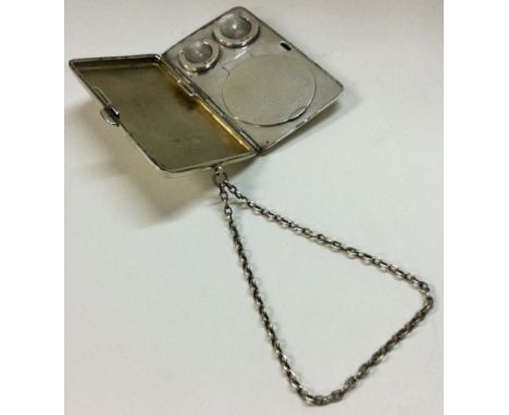 A heavy silver combination double sovereign case / compact / cigarette case on suspension chain. London 1912, By Mappin & Web