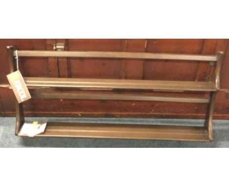ERCOL: A small dark elm plate rack. Est. £20 - £30.