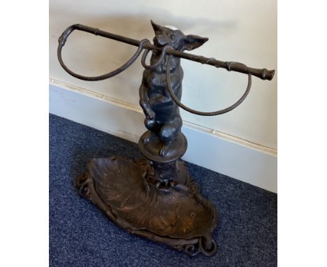 A good wrought iron stick stand attractively decorated with a dog. Est. £100 - £150.