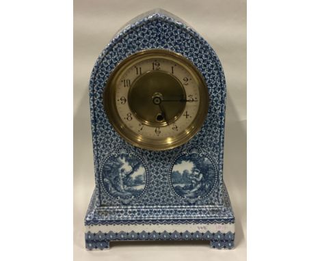 An unusual blue and white wall clock. Est. £20 - £30. 