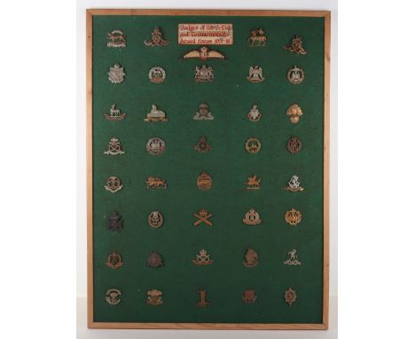 Display Board of British Military Badges, consisting of cap badges of various infantry regiments who served during WW1. Royal