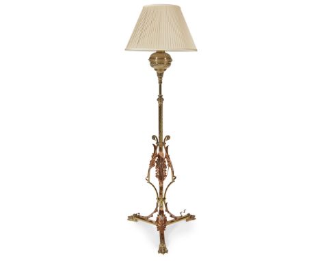 MANNER OF W.A.S. BENSONAESTHETIC MOVEMENT BRASS AND COPPER EXTENDING STANDARD LAMP, CIRCA 1890the spirally fluted reservoir o
