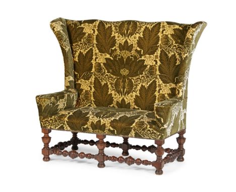 LATE VICTORIAN OAK FRAMED AND UPHOLSTERED HIGH-BACK SETTEELATE 19TH CENTURYin the William and Mary style, the shaped back and