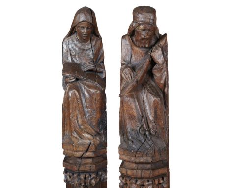 TWO CARVED OAK ECCLESIASTICAL ARCHITECTURAL FIGURAL PILLARSEARLY 18TH CENTURYin the Gothic style, depicting seated figures on