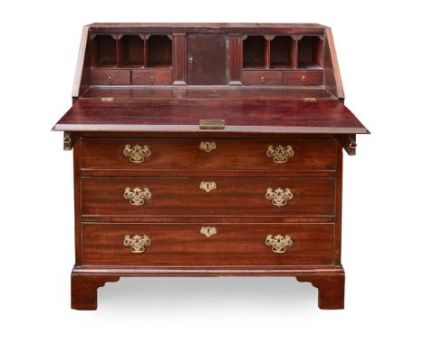 GEORGE III MAHOGANY BUREAU18TH/ EARLY 19TH CENTURYthe moulded fall-front enclosing pigeon-holes, drawers and a writing surfac
