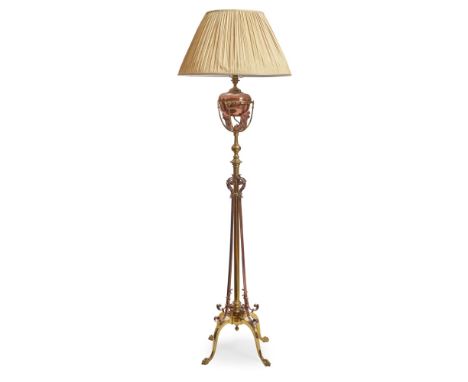 MANNER OF W.A.S. BENSON BRASS AND COPPER EXTENDING STANDARD LAMP, CIRCA 1900the ovoid reservoir with leafy bracket supports o