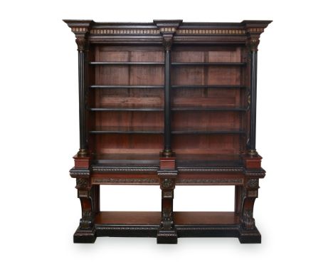 MANNER OF DANIEL COTTIERVICTORIAN GOTHIC REVIVAL CARVED POLYCHROME OAK BOOKCASE, CIRCA 1860the projecting moulded cornice wit