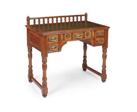 MANNER OF ALFRED WATERHOUSEGOTHIC REVIVAL OAK WRITING TABLE, CIRCA 1870the moulded rectangular top with inset tooled writing 