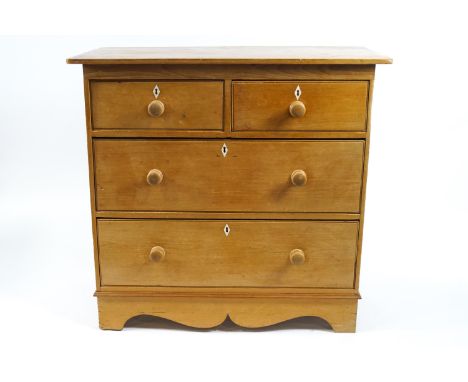 A Victorian pine chest of two short and two long drawers, on bracket feet with ivory escutcheons, 95cm high x 102cm wide x 52