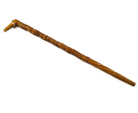 An Africa walking stick, all over carved with elephant head handle, 72cm high