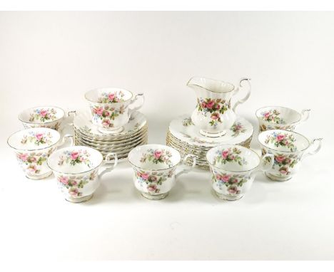 A Royal Albert 'Moss Rose' set of six cups and saucers together with milk jug