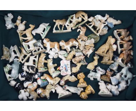 A large collection of Wade Whimsies, First Series, some duplicates, together with a Collector's Catalogue and Price Guide