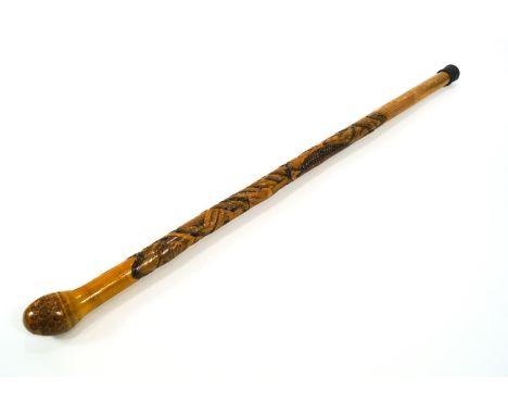 A Japanese bamboo walking stick, carved with a Samurai and a carp, in a rocky landscape, signed to the base, 89cm high