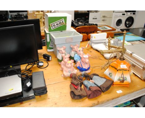 A collection of Wade Natwest piggy banks, a wooden planter, dolls etc