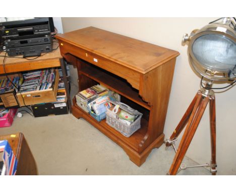 A mahogany finish shelf unit with display cabinet top