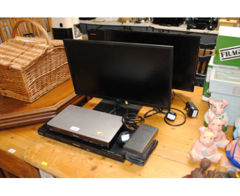 A Cello LCD monitor, a LG monitor, two Panasonic Blu-ray players and a collection of Casio calculators  