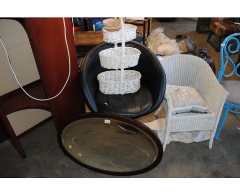 An oval bevel edged mirror; a swivel chair; three tier basket etc.