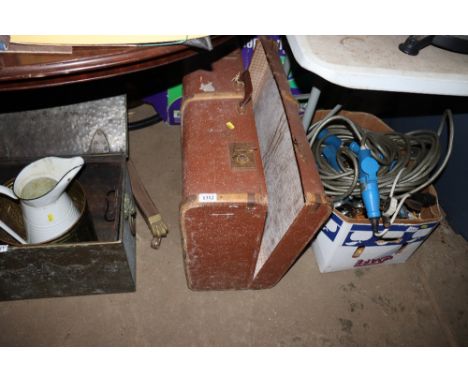 A wooden and metal bound travel trunk