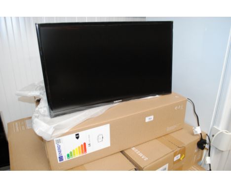 A Samsung C24F390FHR 23.5" curved monitor