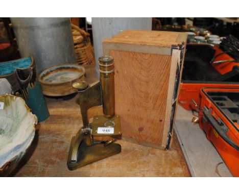 An R & J Beck limited of London microscope with wooden case