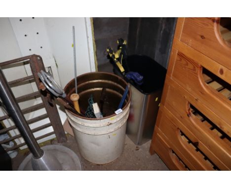 A barrel and a bin of various hand tools, clamps etc