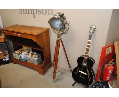 A theatre style spotlight raised on tripod base