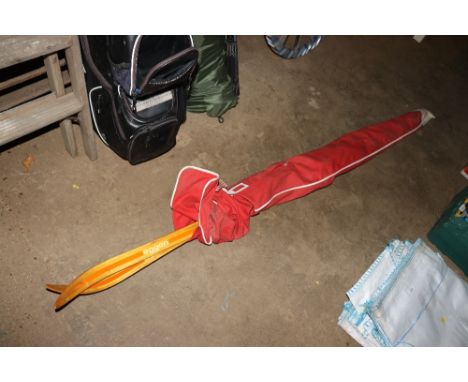 A pair of vintage Gresshoppa skis in carry bag
