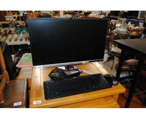 An Acer monitor, keyboard and mouse