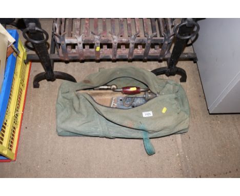 A vintage canvas tool bag and contents