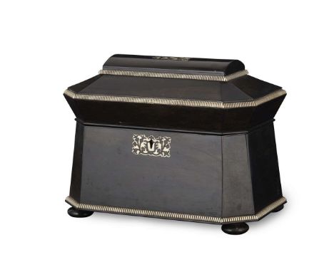  ANGLO INDIAN EBONY AND IVORY TEA CADDY MID 19TH CENTURY of sarcophagus form, outlined with ivory reed banding, the hinged co