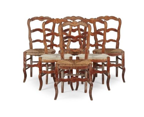  SET OF EIGHT FRENCH PROVINCIAL BEECH DINING CHAIRS 19TH CENTURY with ladder backs and rush seats, comprising six side chairs