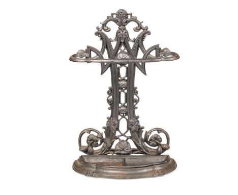  CAST IRON STICK STAND LATE 19TH CENTURY the openwork back cast with nasturtiums above a shaped drip pan 48cm wide, 72cm high